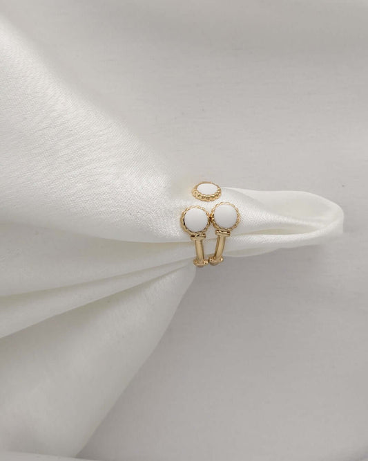 Stackable gold rings featuring white enamel accents for women
