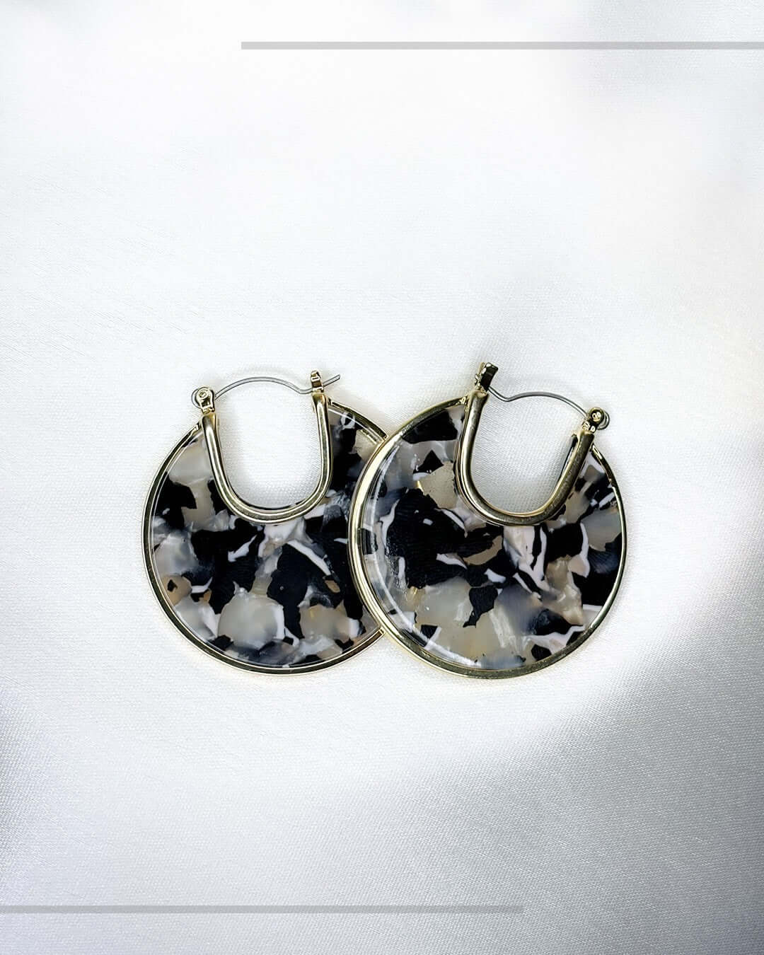 Black and white marble statement hoop earrings with lightweight modern design