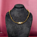 Front view of the Beaded Chain Necklace displayed on a black bust showcasing the polished gold cubes and snake chain.