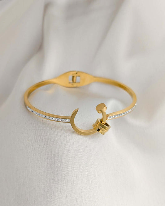 Modern gold cuff bracelet inspired by nail design with sparkling crystal accents