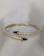 Gold crystal arrow cuff bracelet with open design