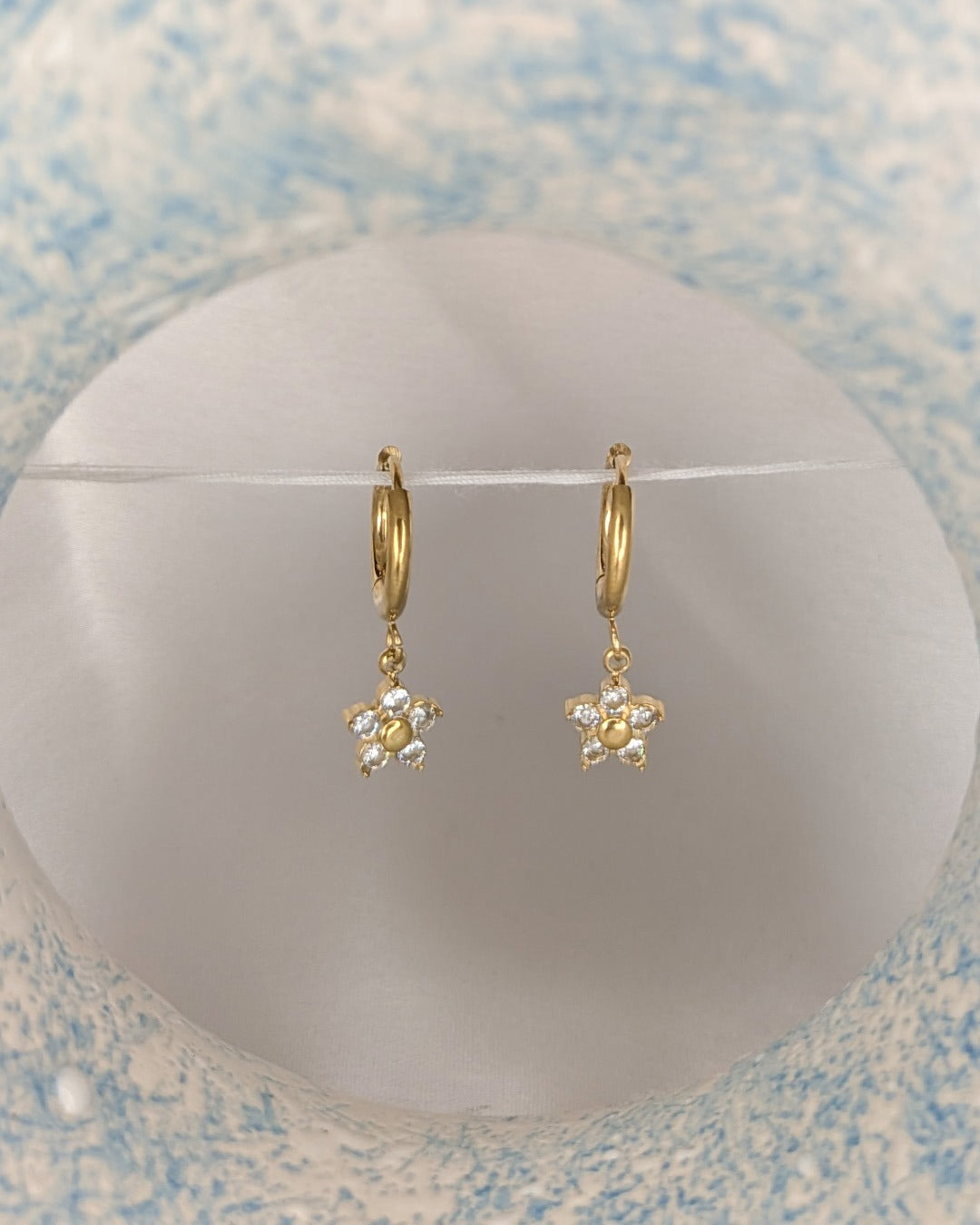 Daisy Spark Drop Earrings featuring crystal flower charms and anti tarnish gold hoops