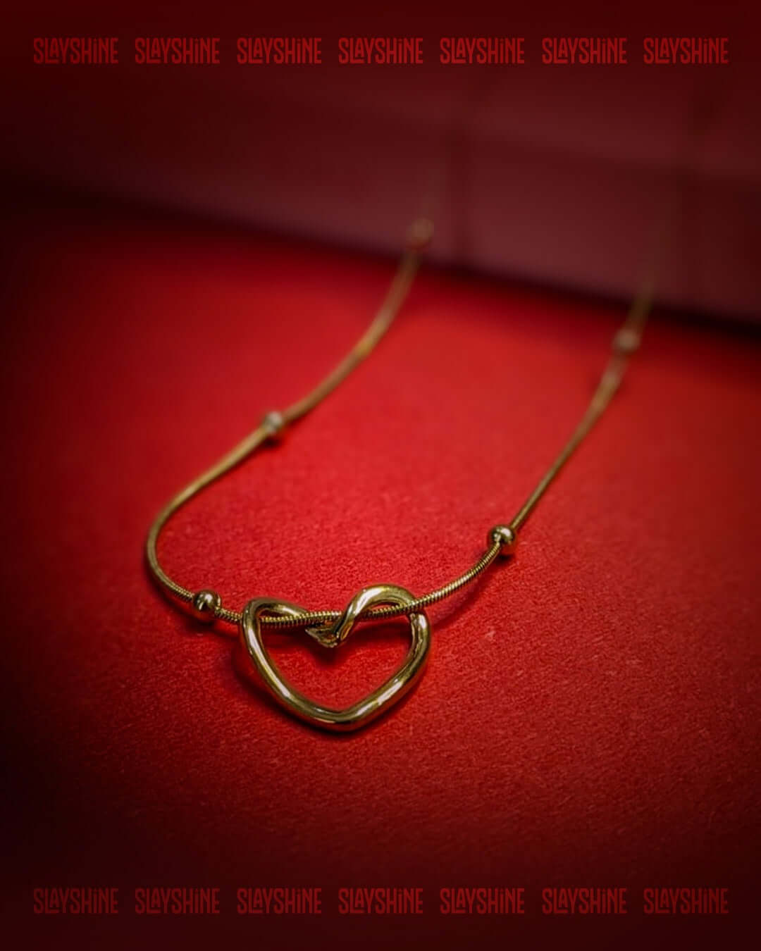 Minimal gold heart necklace with knot detail and premium anti tarnish finish