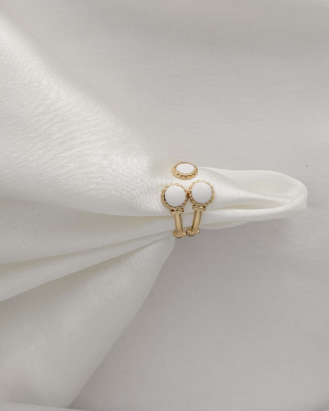 Stackable gold rings featuring white enamel accents for women