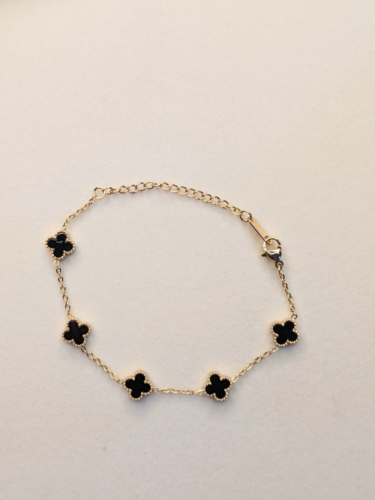 Midnight Clover Bracelet with black clover charms and anti tarnish gold chain